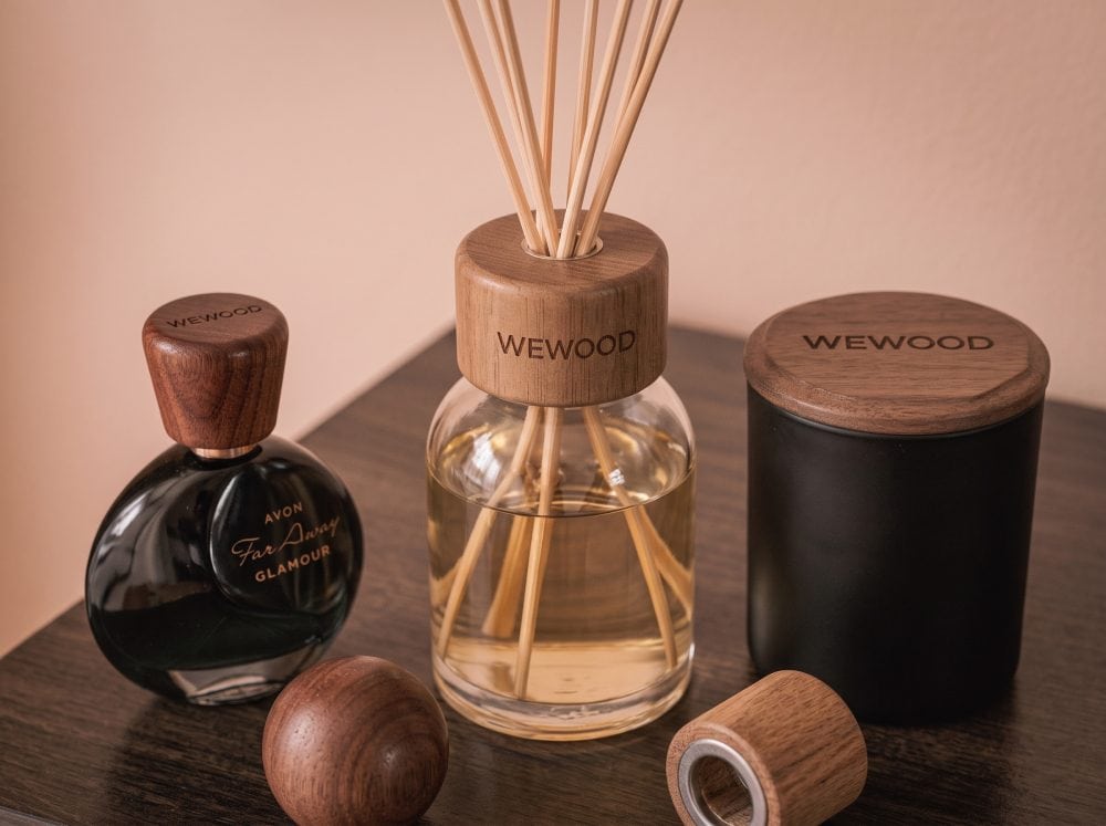 Engineered brand premiumization packaging featuring custom wooden caps and lids